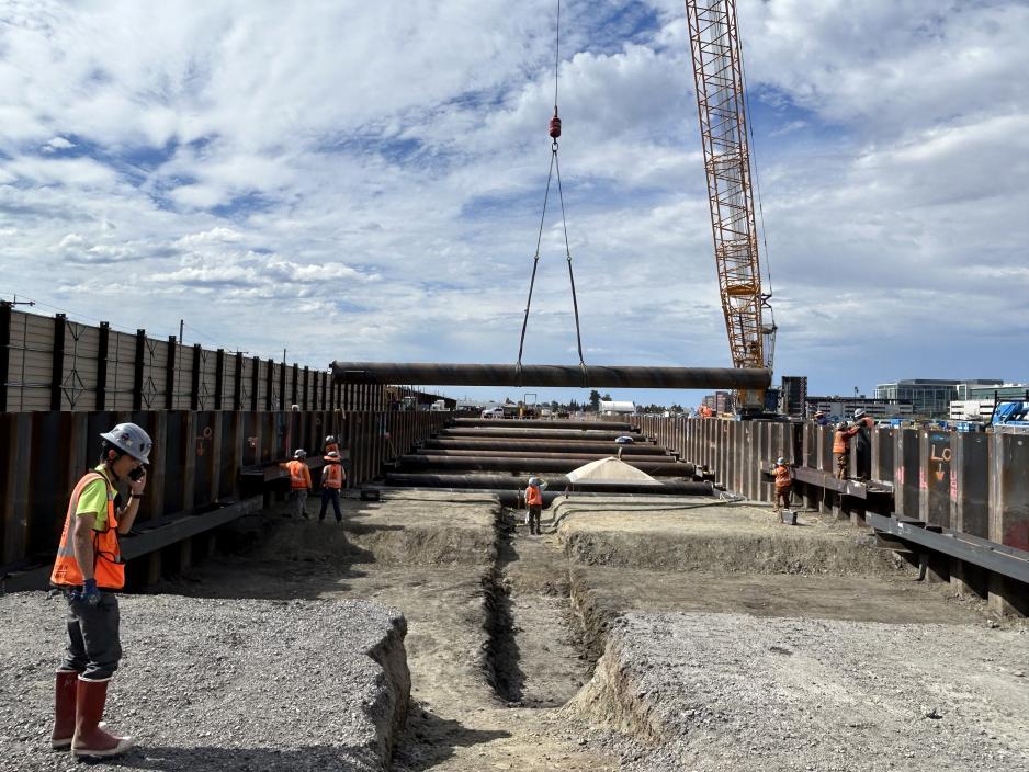 construction site with a dirt path and entrance to a tunnel