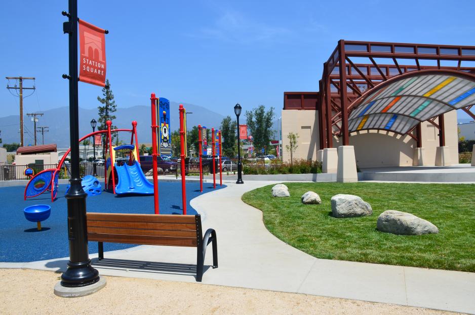 Photo of play structure and shaded amphitheater next to transit center