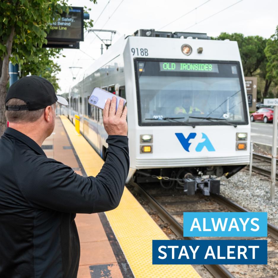 Rider waving at light rail train