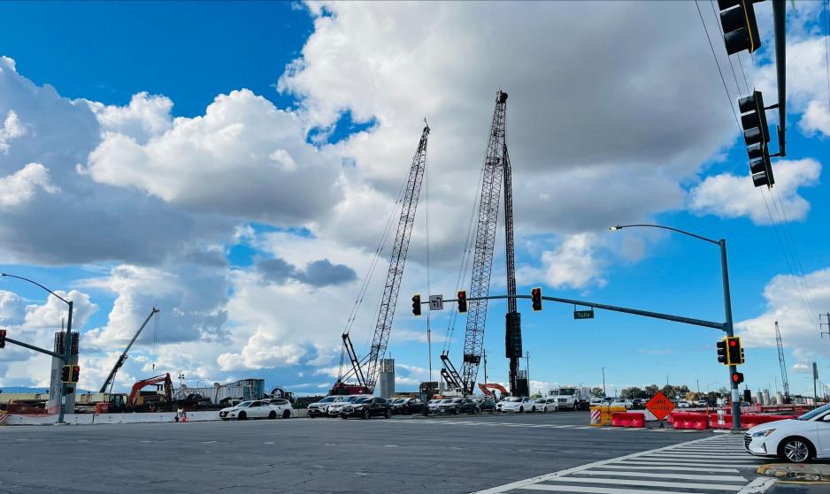 Two 164-ft cranes stand on the northwest corner of Capitol Expressway and Tully Road for sheet and pile driving to build the foundation and columns that will support the guideway transition from the median to the west side of Capitol Expressway.